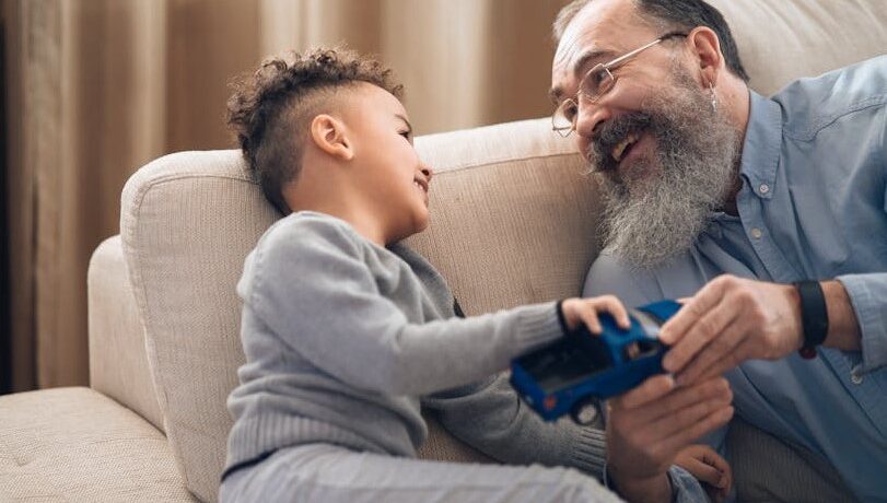 Grandpa and grandson on couch