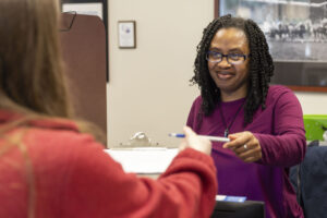 Friendly DINW staff welcoming a patient for their exam