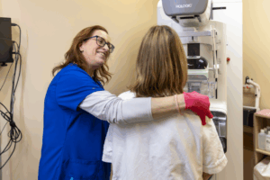 Female technologist comforting a patient before a 3D mammogram exam at Diagnostic Imaging Northwest.